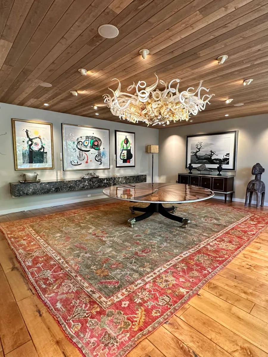 Color-restored Oushak rug installed in a Wilmette dining room after conservation cleaning — Ahmadi Rug