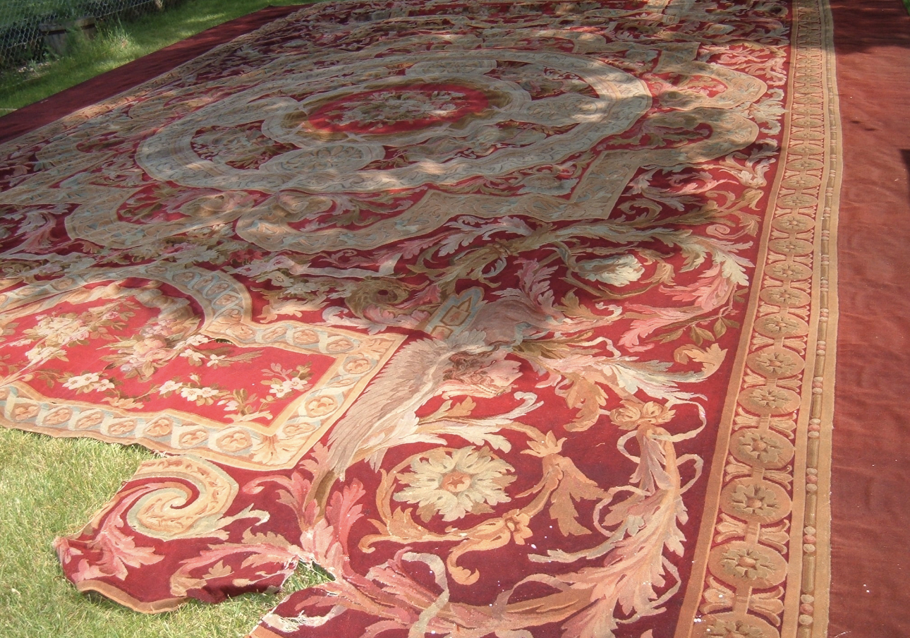 Large ornate red abuson rug