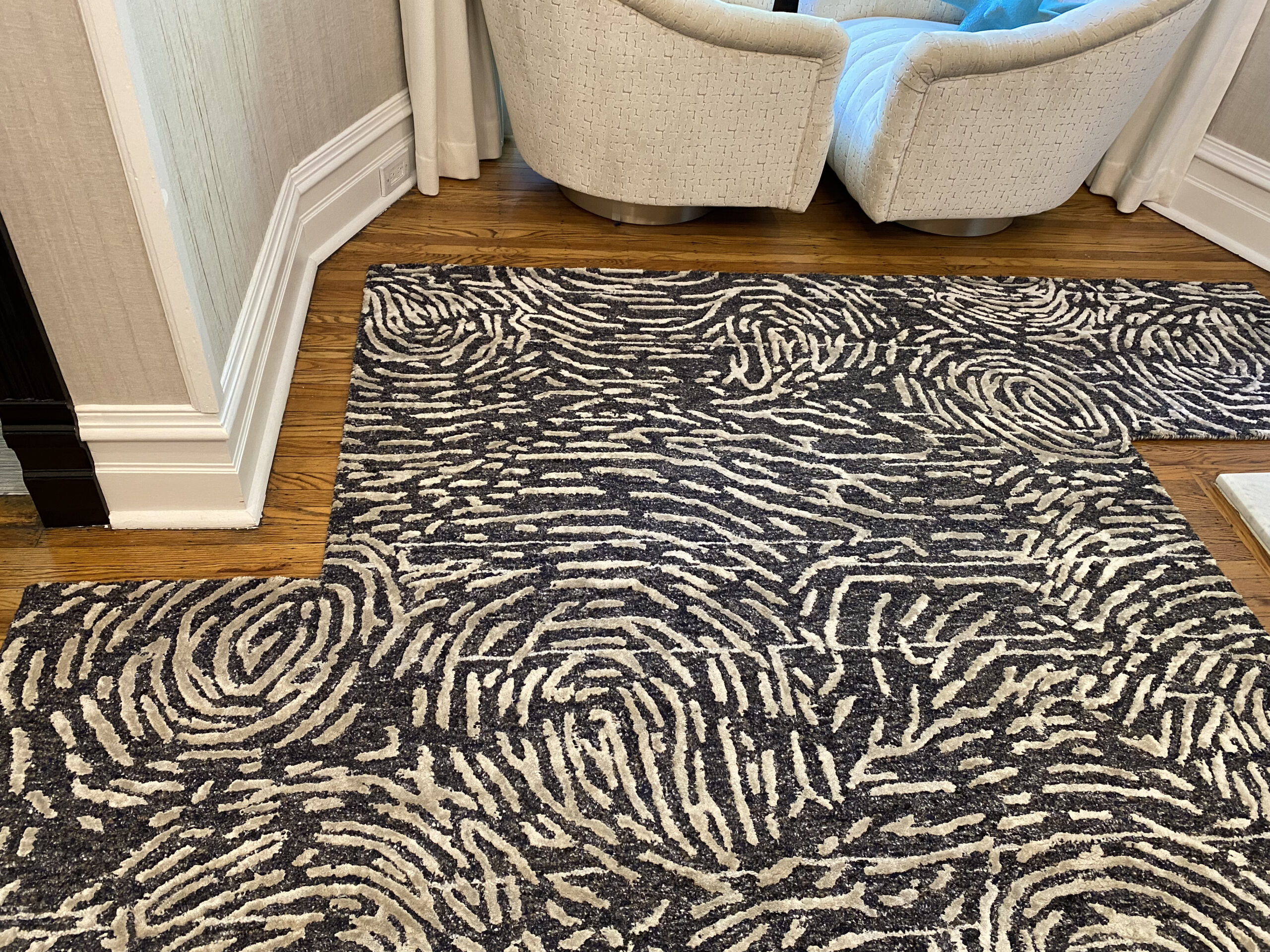 Abstract patterned customized rug on wooden floor