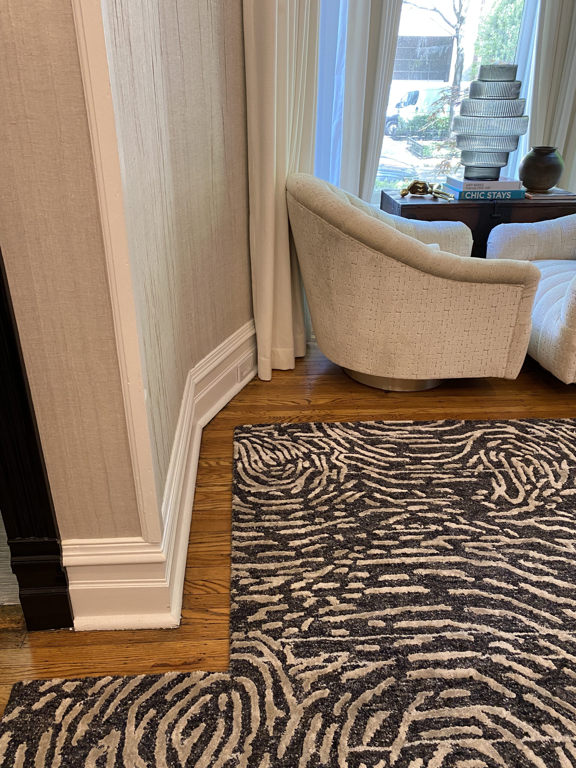Cozy living room with customized patterned rug.